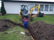 Stavba kanalizace ze střechy do rybníka na návsi
